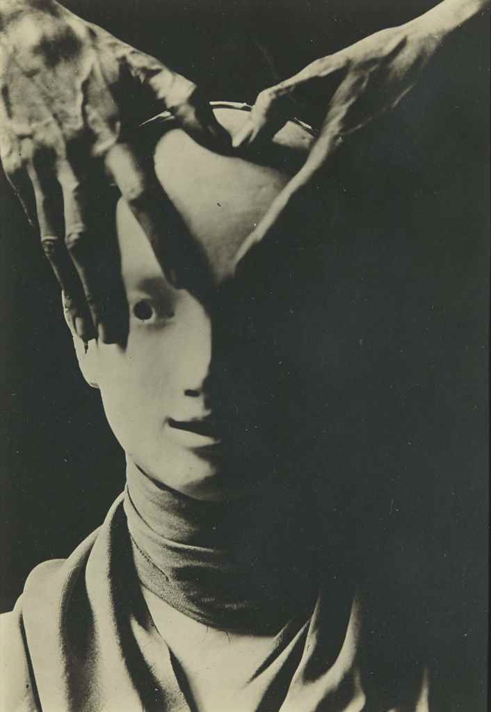 Cocteau's Hand on Mask of Antigone by Berenice Abbott, 1927
