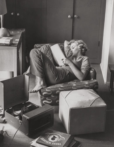 Marilyn (reading in her apartment)