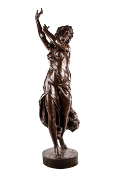 A bronze sculpture of a female figure in a dynamic dance pose.