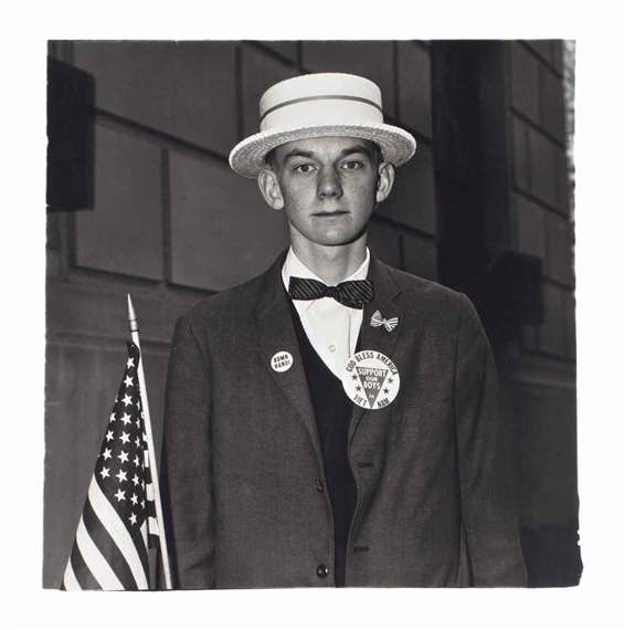 Boy with a straw hat waiting to march in a pro-war parade, N.Y.C. by Diane Arbus, 1967
