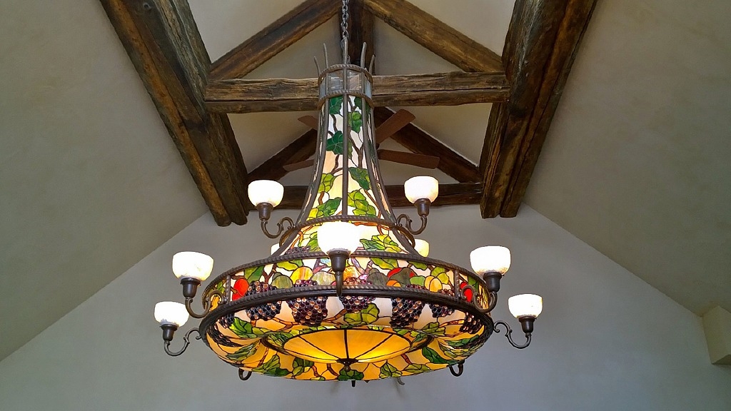 Artwork by Peter M. Fillerup, Fruit Cluster Chandelier, Made of bronze, hand blown stained glass, alabsater sconces