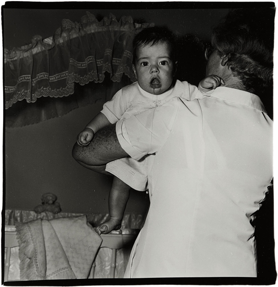 Toddler being held by nurse, N.J