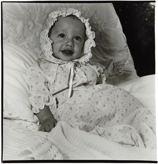 Baby in a lacey bonnet, N.Y.C by Diane Arbus, 1968