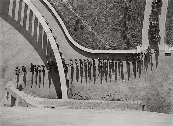 Walking crowd with shadows, taken from above (Deutsches Stadion, Berlin) by Alexander Stöcker, 1930