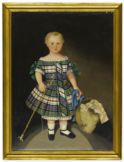 BLONDE BOY IN PLAID DRESS AND HOLDING A WHIP