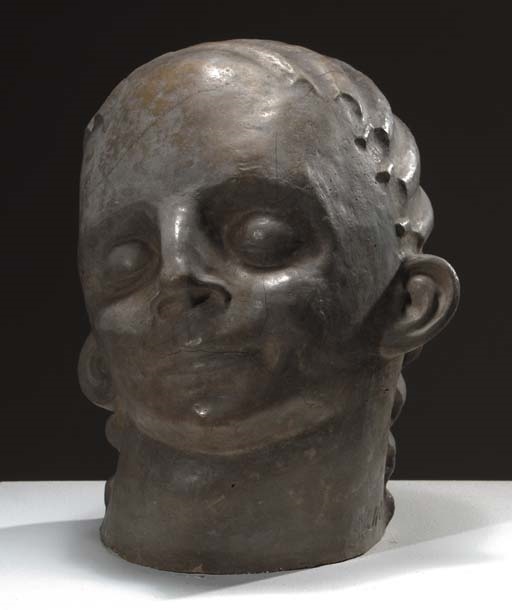 Artwork by John Rädecker, A head, Made of concrete