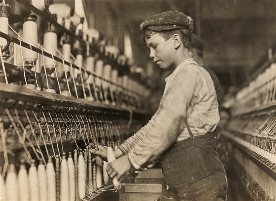 Doffer Boy in Georgia cotton mill by Lewis Hine, 1909