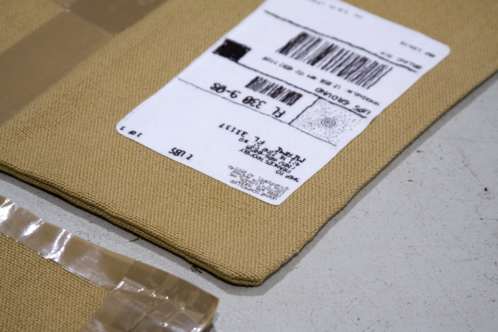 Artwork by Frances Trombly, Box (Broward Paper and Packaging), Made of Hand woven fabric, embroidery, packing tape