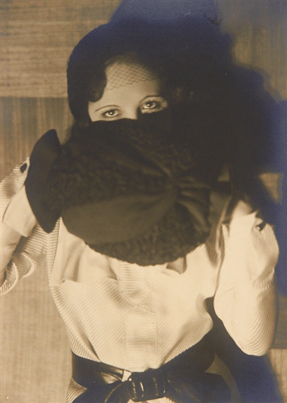 Woman behind muff by Germaine Krull, 1929