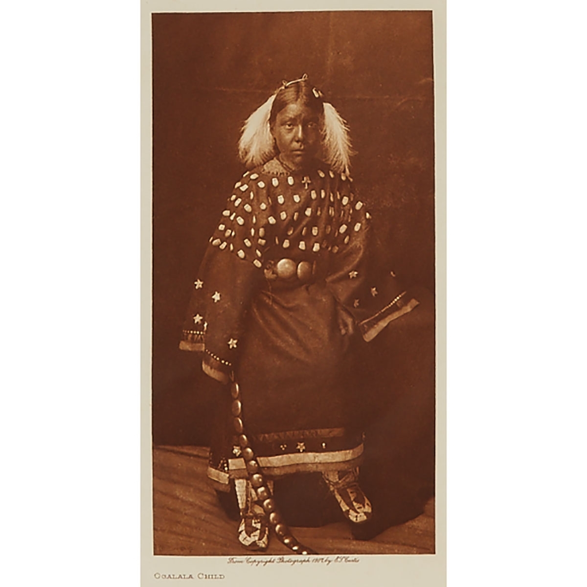 3 Works: FROM "THE NORTH AMERICAN INDIAN"; OGALALA CHILD; ELK HEAD, AND THE SACRED PIPE BUNDLE by Edward S. Curtis, 1907