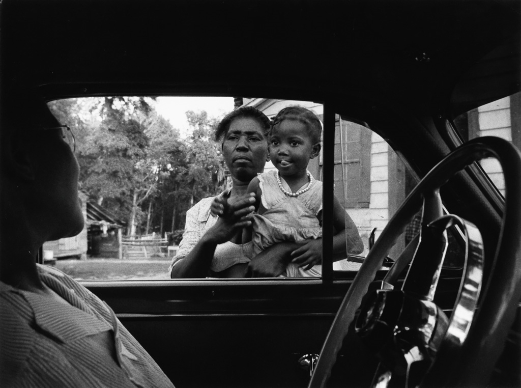 Woman and child by car window by W. Eugene Smith, 1951