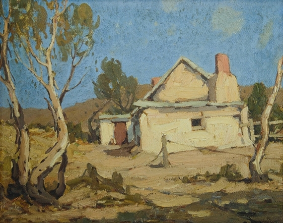A rustic rural scene featuring a weathered house nestled among dry trees under a clear blue sky.