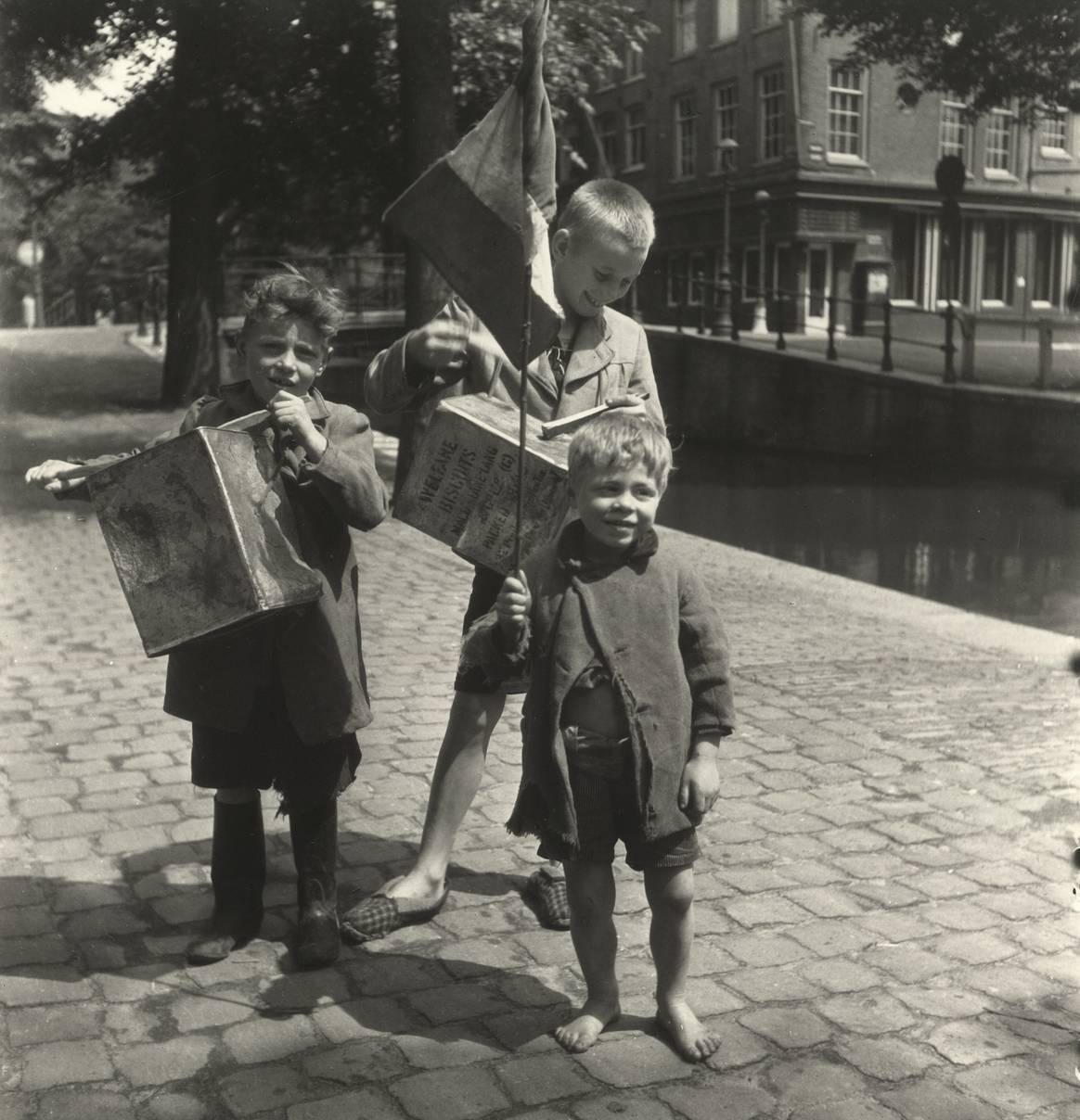 Artwork by Emmy Andriesse, 4 works: Three Amsterdam boys parading with their selfmade drums, Made of Gelatin silverprint