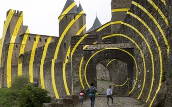 Locals See Red Over 'Fluorescent Yellow' Circles Covering Carcassonne Fortress in the Name of Art