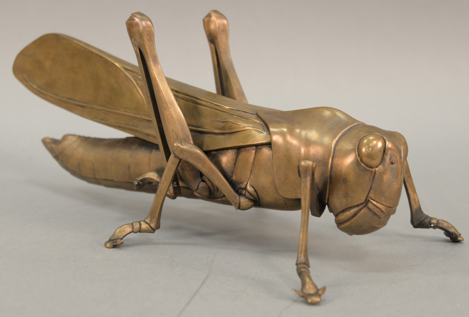 Artwork by Philip Grausman, Grasshopper, Made of bronze