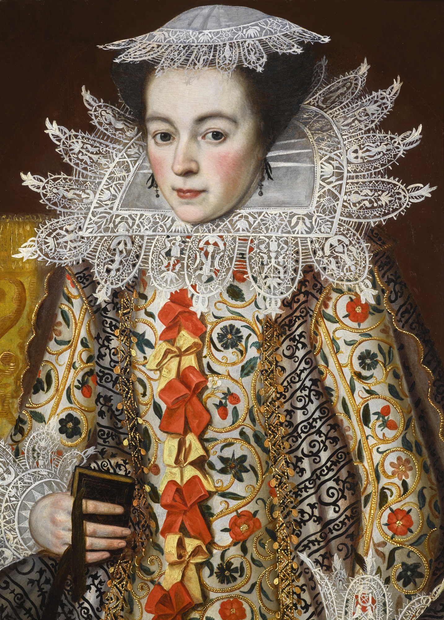 Artwork by William Larkin, PORTRAIT OF A LADY, HALF-LENGTH, WEARING AN ELABORATELY EMBROIDERED WAISTCOAT WITH RED AND YELLOW RIBBONS, LACE COLLAR AND LACE CAP, HOLDING A PRAYER BOOK, Made of oil on oak panel