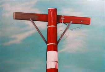 A red and white striped pole with a horizontal beam against a cloudy sky.