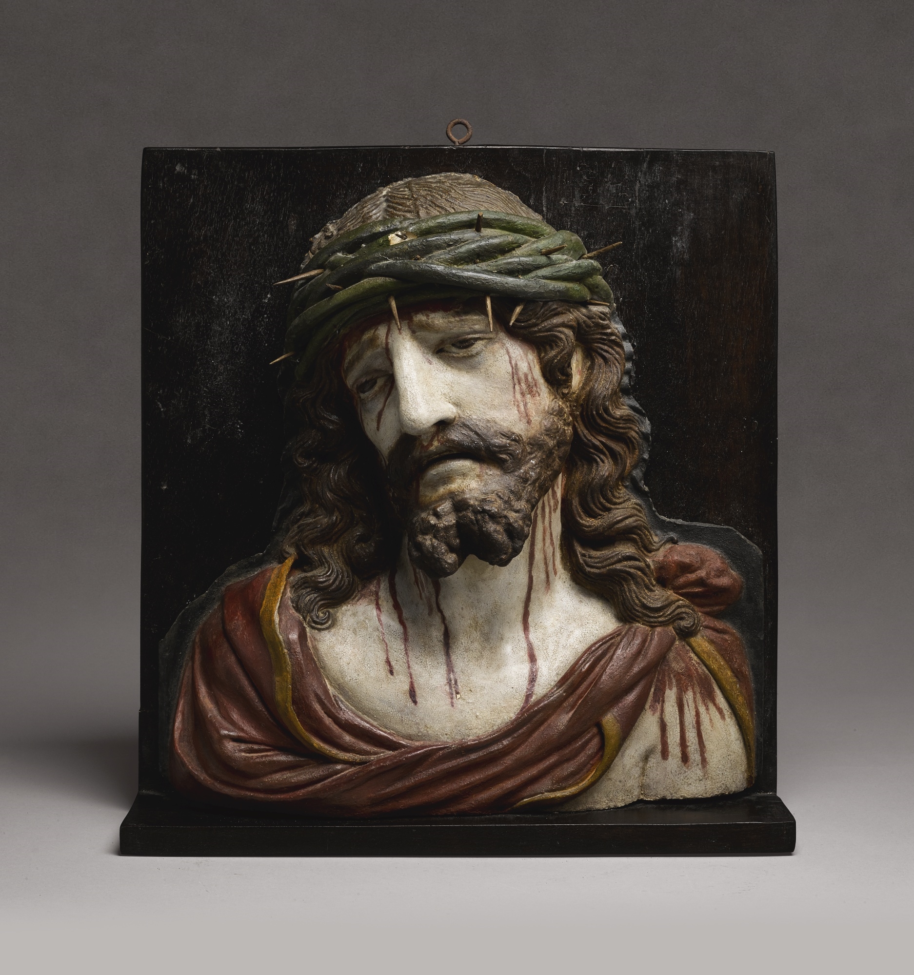 Artwork by Hermanos Garcia, RELIEF BUST OF THE ECCE HOMO, Made of polychromed terracotta, with wood thorns, mounted on a later wood board