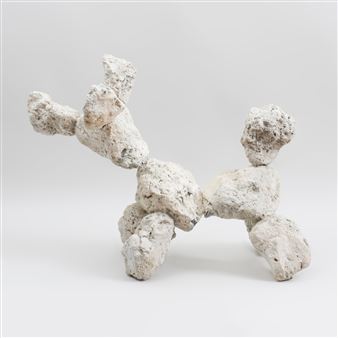 A textured, blocky sculpture of a four-legged animal in motion.