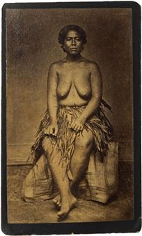 Samoan woman in traditional fibre skirt seated on a hwat - John Davis