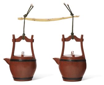 TWO BARREL-FORM YIXING TEAPOTS AND COVERS WITH A BAMBOO-FORM CARRYING POLE, 'BALANCE' - Lu Wenxia