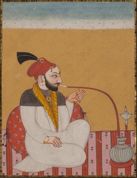 Indian School, 19th Century | A pahari raja seated smoking a hookah,  wearing a red turban and white jama with yellow collar | MutualArt