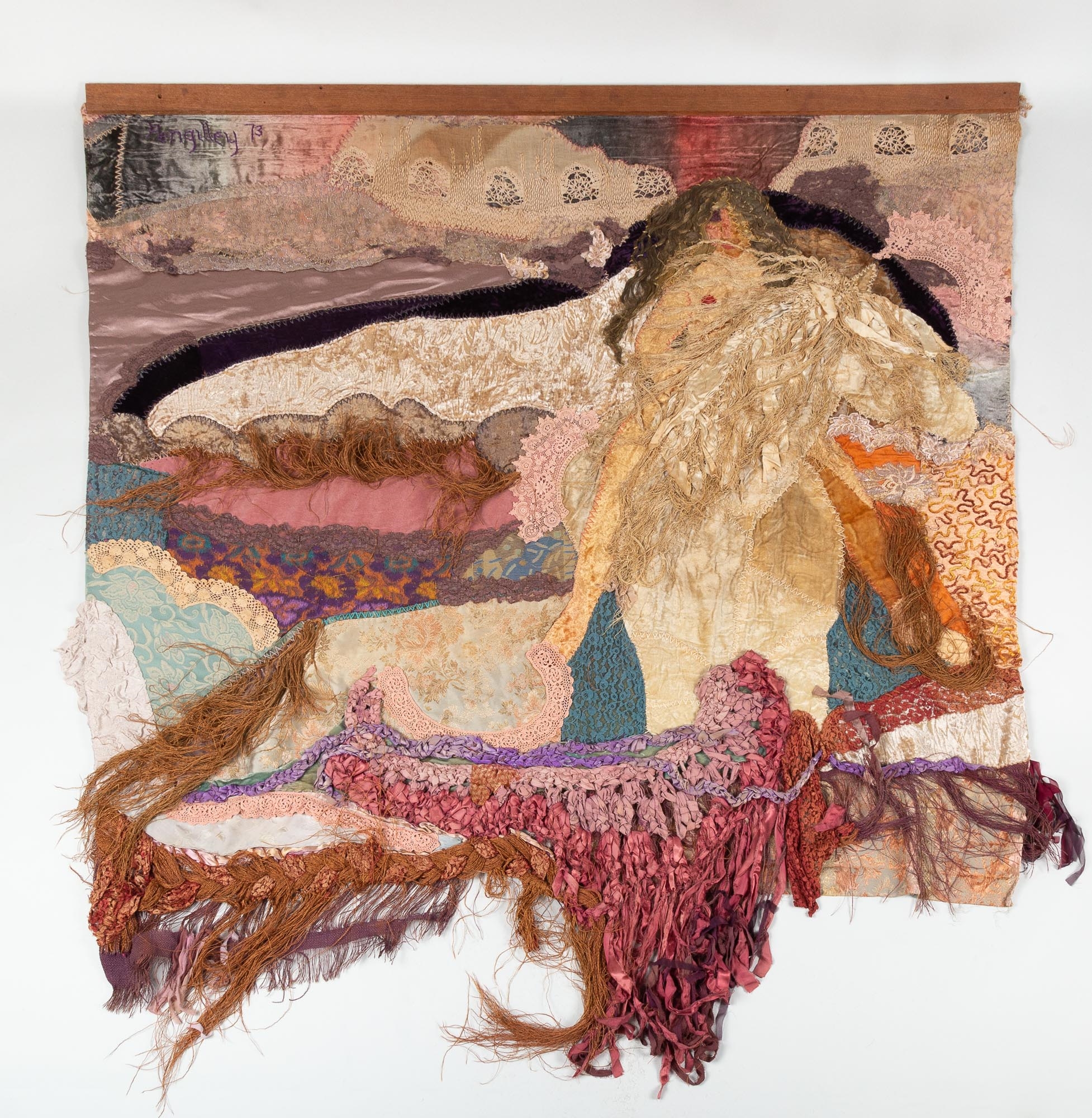 Artwork by Vivienne Pengilley, Untitled textile of a caped lady riding a horse, Made of composed of cloth fragments, predominately velvet and antique lace work, each fragment sewn onto a cloth tapestry backing