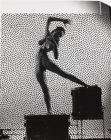 Nude on drums by Weegee, circa 1955