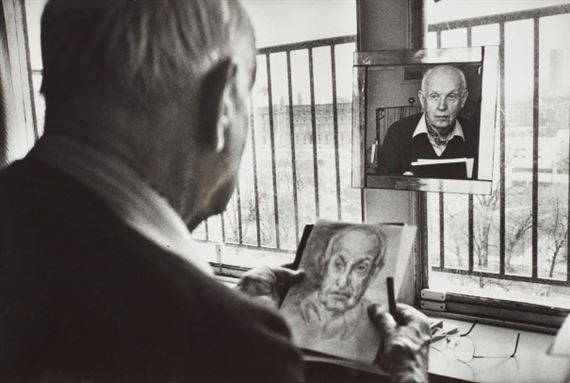 Henri Cartier-Bresson drawing a self-portrait in his studio by Martine Franck, 1992