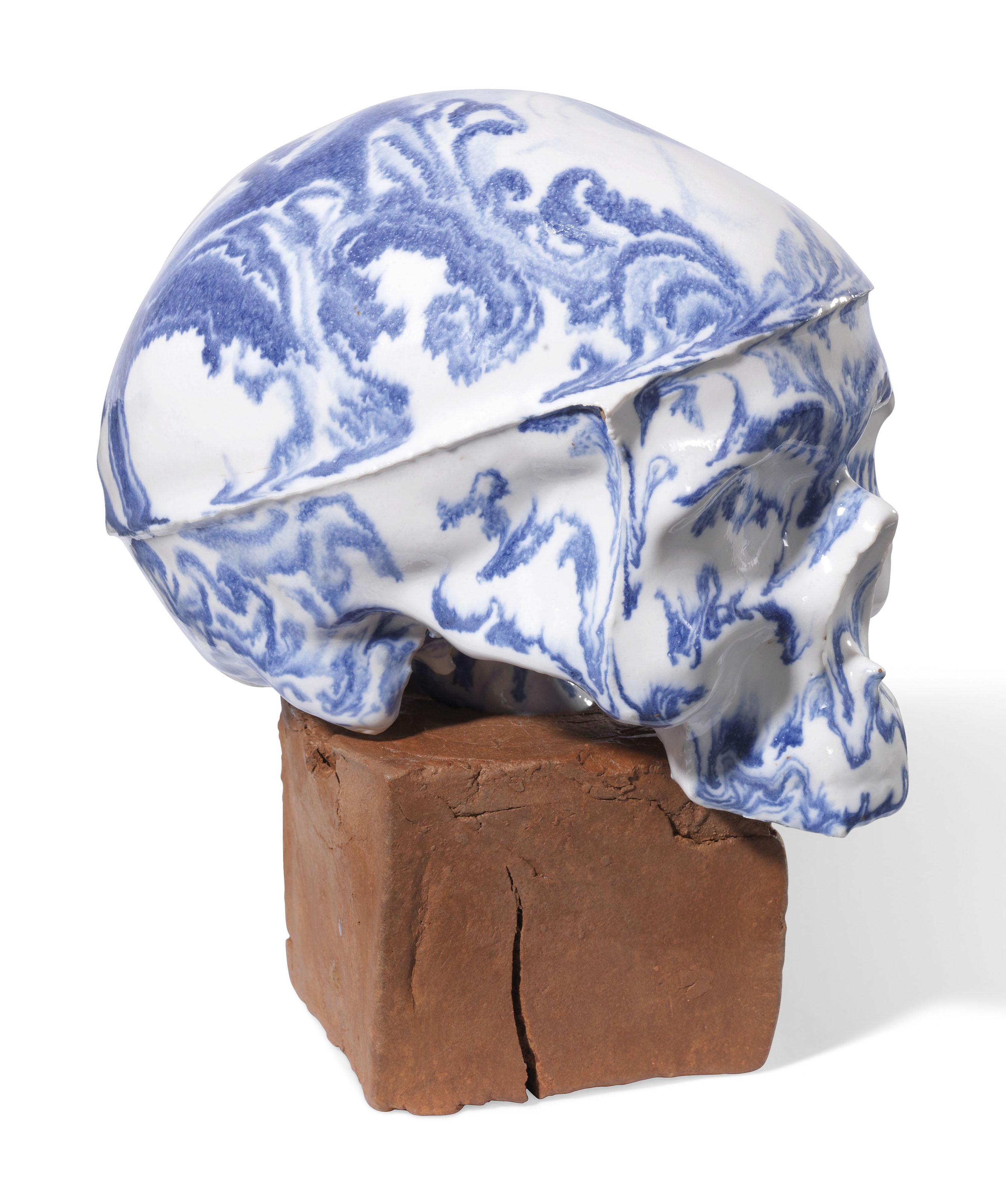 Artwork by Michelle Erickson, Delft Skull, Made of Tin glazed slip cast porcelain with overglaze
