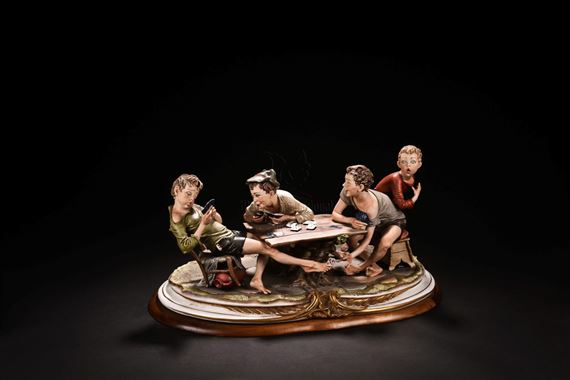 Four Lively Children Playing Card Games on the Table by Bruno Merli