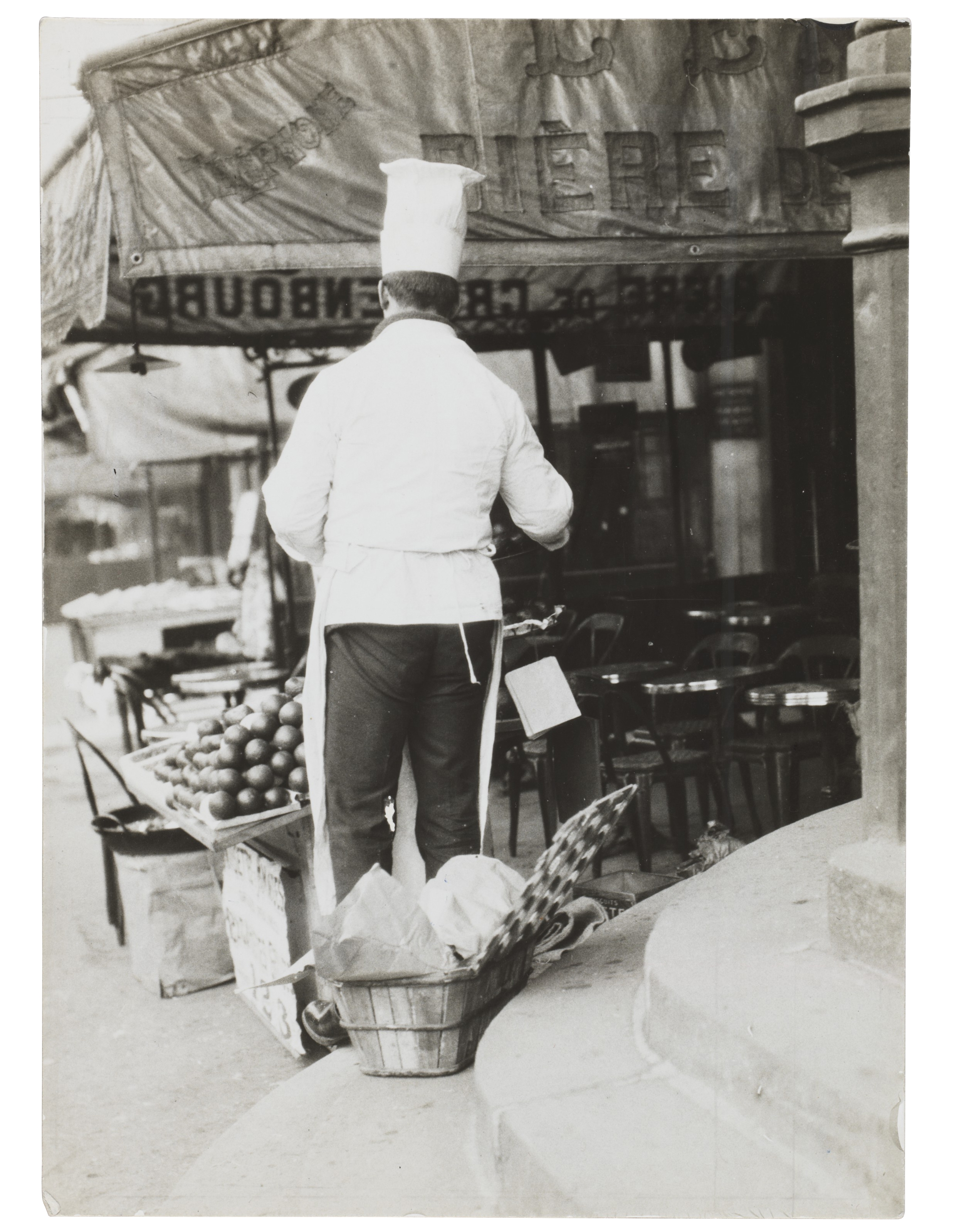 Chef examining freshly delivered produce for the day ahead (Paris) by Germaine Krull, circa 1931