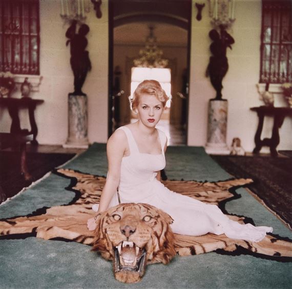 Slim Aarons | Mrs George Cameron at home, c. 1953 (1995) | MutualArt