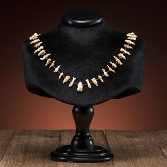 single-strand necklace strung with heishi and carved fetishes, including birds, fish, bears, rabbits, and frogs; signed silver tag on clasp, length 33.75 in.
third quarter 20th century - Peter and Dinah Gasper