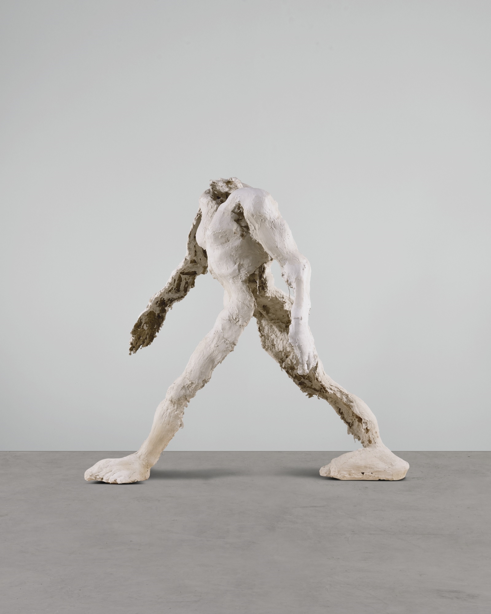 Artwork by Thomas Houseago, WALKING MAN, Made of plaster