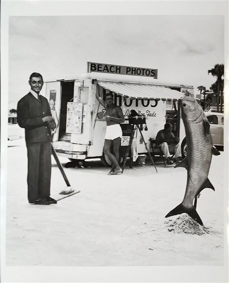 Beach photo with Clark Gable and fish, Daytona Beach, Florida by Berenice Abbott, 1954