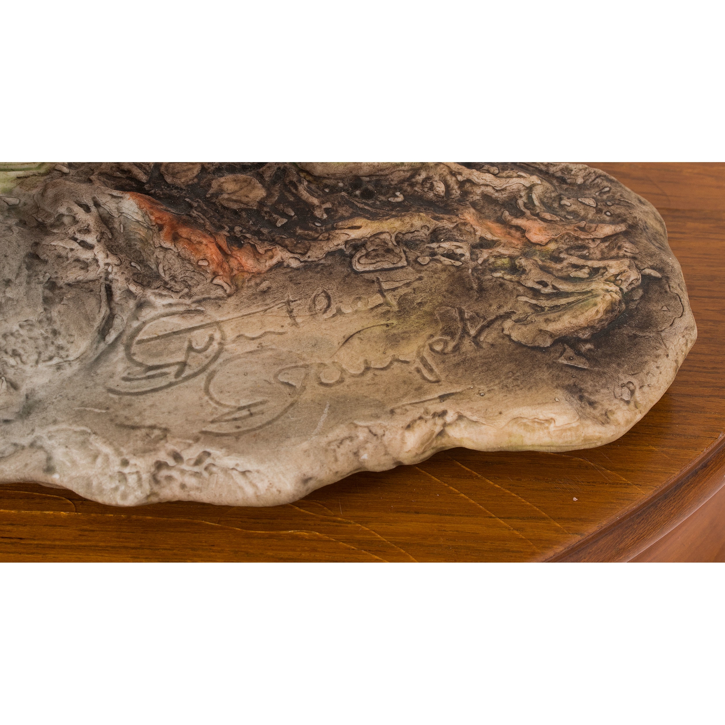 A sculptural group of pheasants in flight and rest, rendered in vibrant colors on a wooden base.