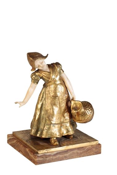 A GILT BRONZE AND IVORY SCULPTURE: GIRL WITH PAIL by Charlotte H. Monginot