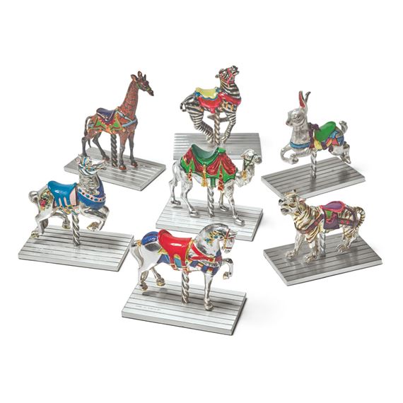 A GROUP OF SEVEN SILVER AND ENAMEL CAROUSEL FIGURES, DESIGNED BY GENE MOORE FOR TIFFANY & CO., NEW YORK by Gene Moore, CIRCA 1990