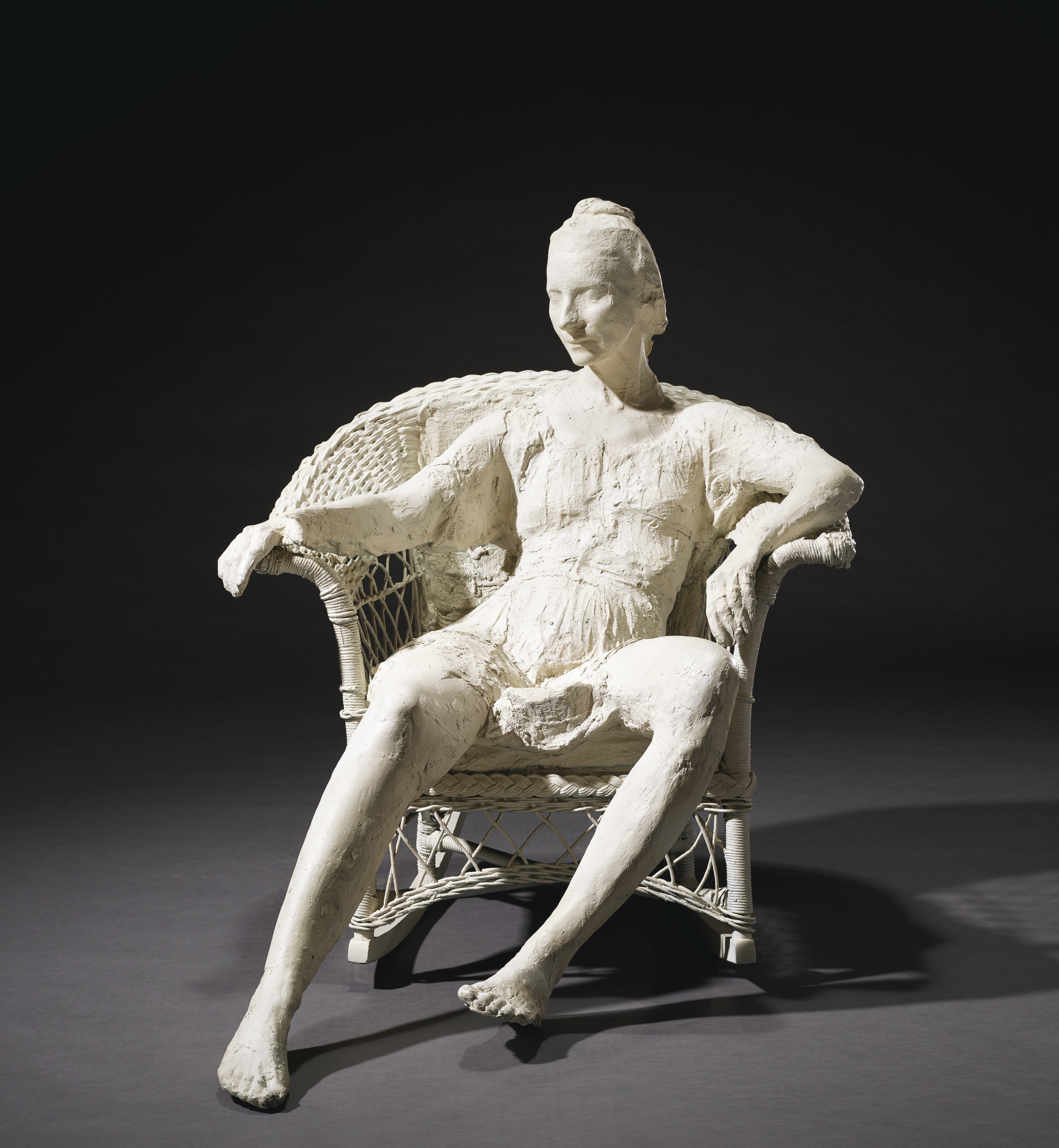 Artwork by George Segal, Woman on White Wicker Rocker, Made of bronze with white patina