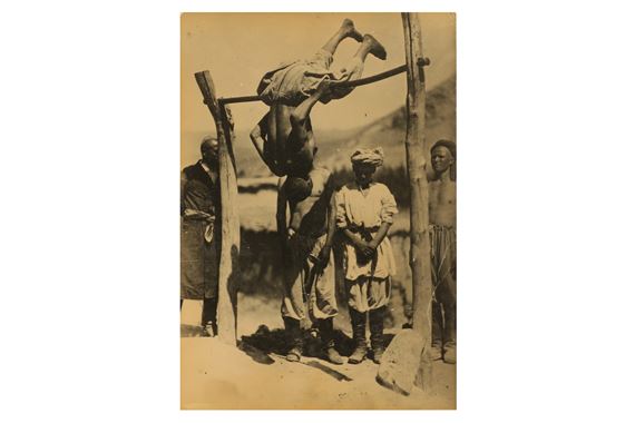
MAN SWINGING ON BAR by Georgi Zelma, 1927