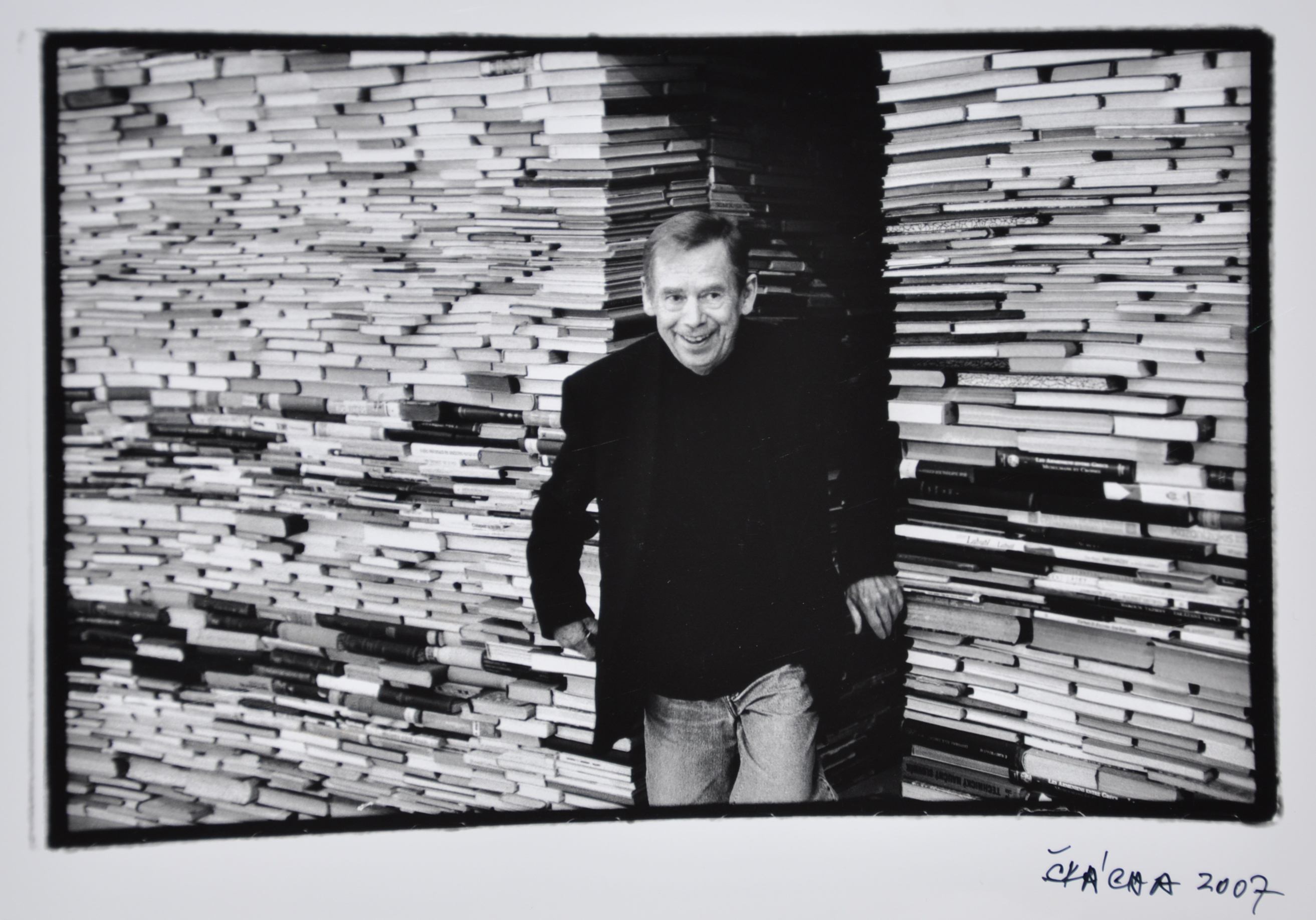 Artwork by Oldřich Škácha, Václav Havel among books in DOX, Made of photo