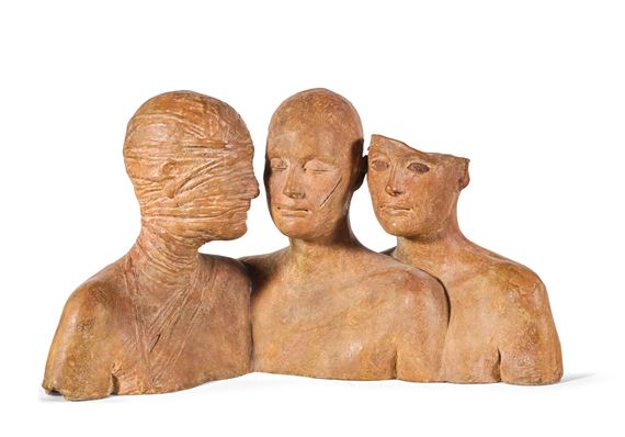A sculptural group of three figures with textured, earth-toned surfaces and expressive faces.
