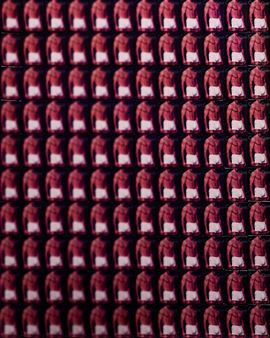 A grid of identical figures in red shirts and white pants.
