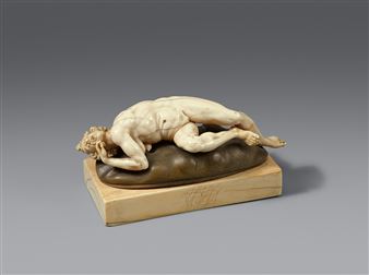 A carved ivory figure of an old woman - Master of the Furies