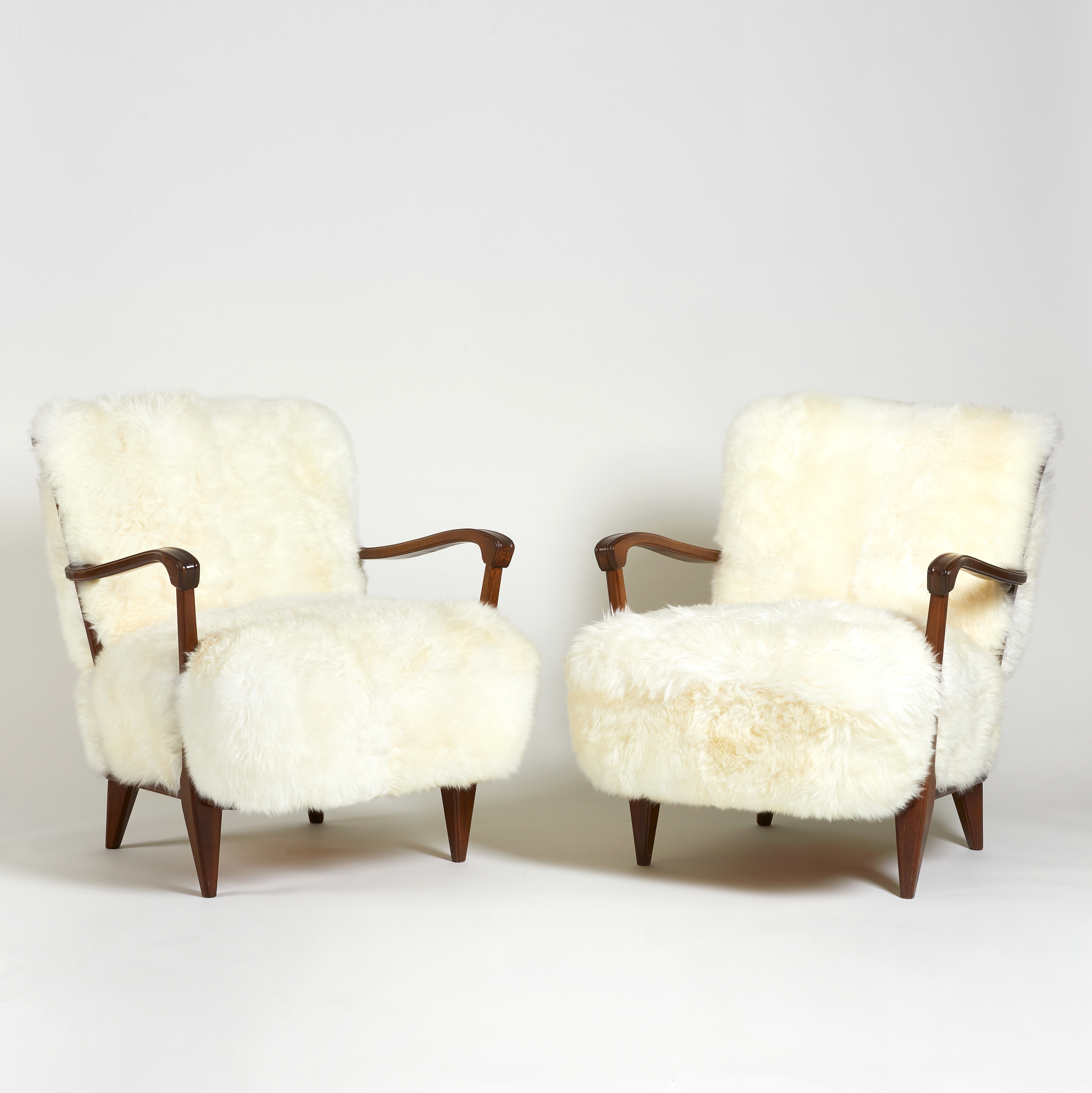 Artwork by Svante Skogh, Two Works: Fåtöljer, Made of legs and armrests in stained beech, upholstered in long-haired white sheepskin