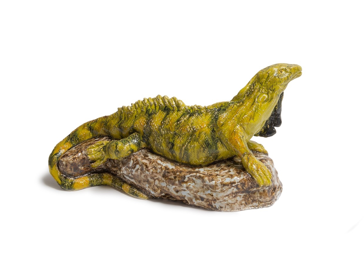 Artwork by Chris Mason, Basilisk Lizard on a rock, Made of glazed earthenware