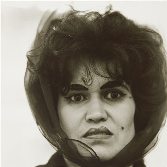‘PUERTO RICAN WOMAN WITH A BEAUTY MARK, N. Y. C.’ by Diane Arbus, 1965