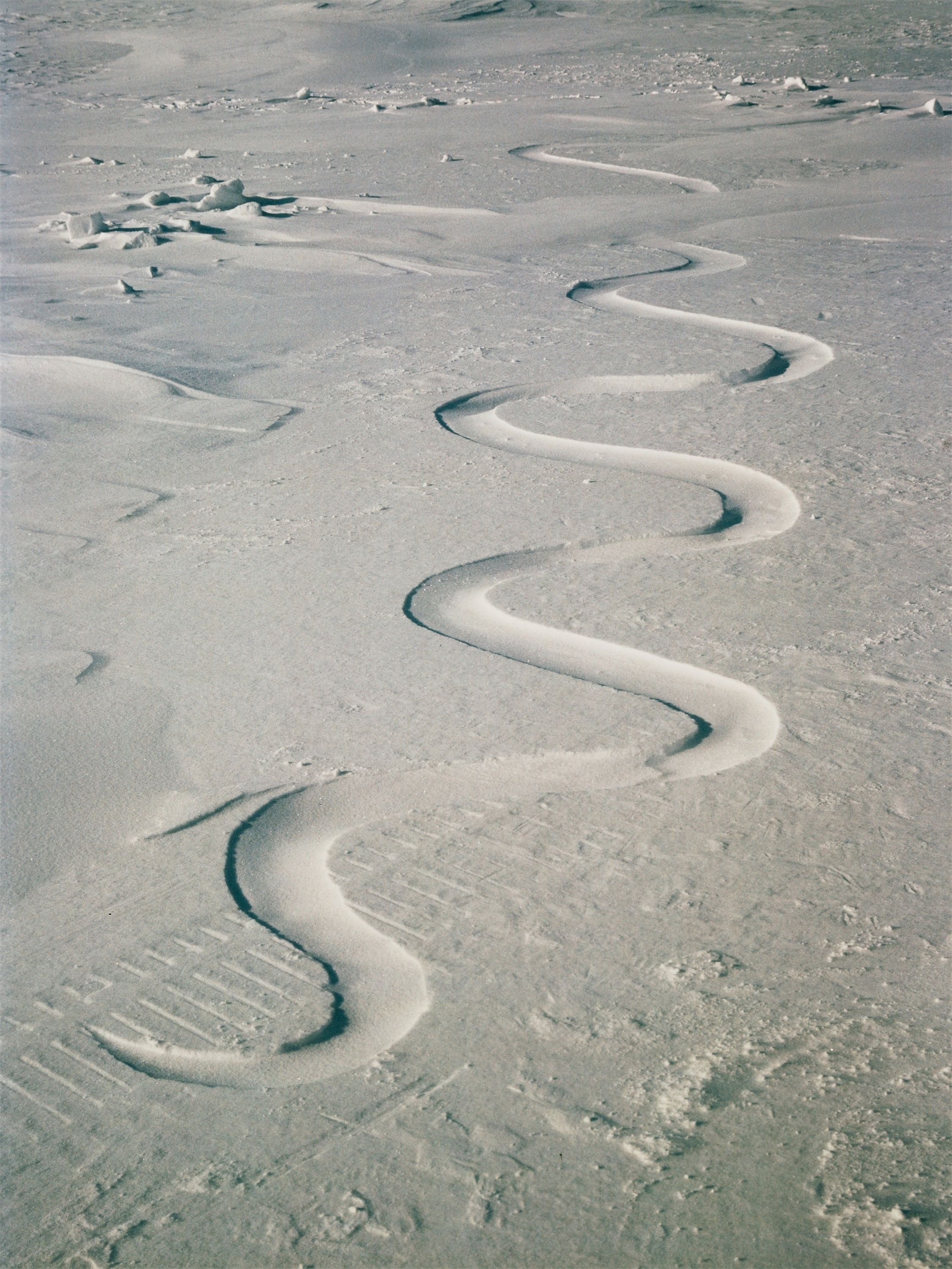 "Snow Drift, carved into, waiting for the Wind. Grise Fiord, Ellesmere Island, 12 April“ by Andy Goldsworthy, 1989