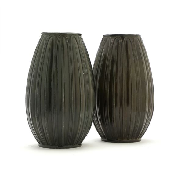 Just Andersen | A pair of patinated “disco” metal vases pattern in relief | MutualArt